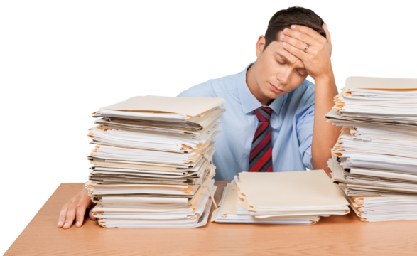 Tired young businessman with many business papers