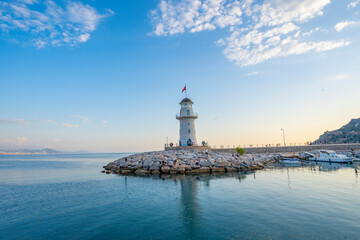 Fototapeta na wymiar A wonderful lighthouse at sunset on the Mediterranean coast