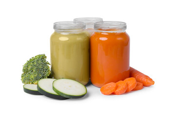Jars of healthy baby food and fresh vegetables on white background