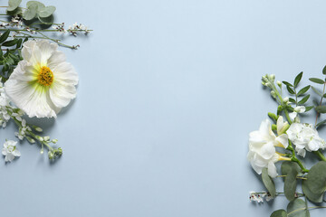 Different beautiful flowers on light grey background, flat lay. Space for text
