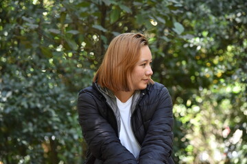 Woman Model sitting in the Botanical Garden of Bogota Colombia