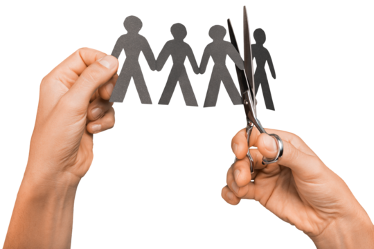 Closeup of Hands Cutting Paper People