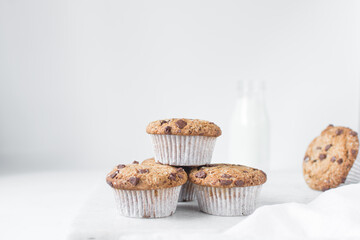 Homemade chocolate chip muffins with selective focus, bakery style chocolate chip muffins with white liners