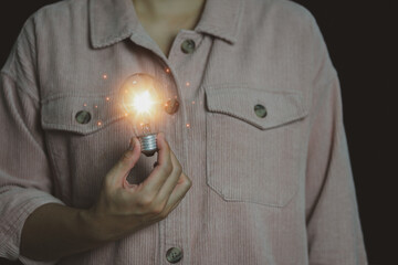 New concept with innovation and technology inspiration. Innovation in science and communication concepts, idea. Creativity. Thinking. Innovation. Hand holding a light bulb for ideas. 
