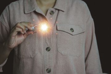 New concept with innovation and technology inspiration. Innovation in science and communication concepts, idea. Creativity. Thinking. Innovation. Hand holding a light bulb for ideas. 