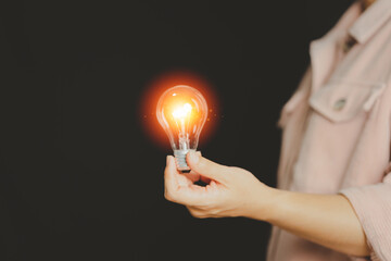 New concept with innovation and technology inspiration. Innovation in science and communication concepts, idea. Creativity. Thinking. Innovation. Hand holding a light bulb for ideas. 