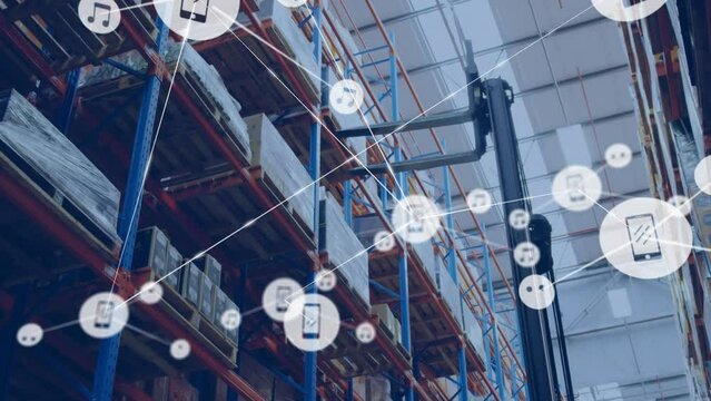 Animation of connected icons, low angle view of forklift placing boxes on racks in warehouse