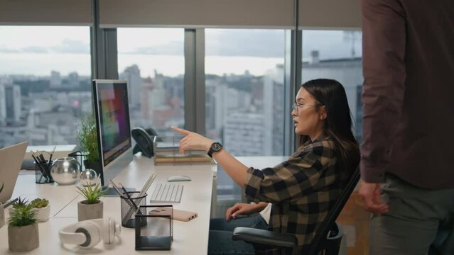 Eyeglasses woman greeting colleague at office closeup. Man watching computer