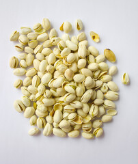 Pistachios isolated on white background, top view. 