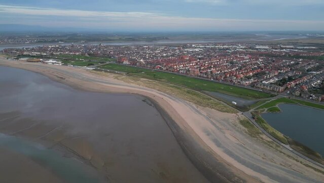 Stationary altitude pan of suburban peninsula at Fleetwood Lancashire UK revealing River Wyre Estuary and Knott End