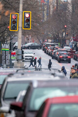 Fototapeta premium People Crossing the Street in Washington DC During a Snow Storm
