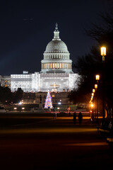 Fototapeta na wymiar Night Long Exposure Photo of Washington DC Capital Building During Christmas With Construction