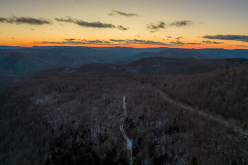Aerial Drone View of West Virginia Snowshoe Mountain at Sunset with Some Snow