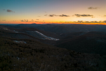 Aerial Drone View of West Virginia Snowshoe Mountain at Sunset with Some Snow