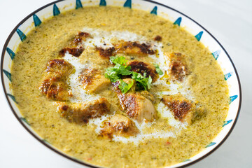 Afghani chicken in green curry or Hariyali tikka chicken hara masala