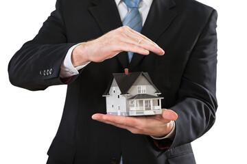 Businessman with mini house on background