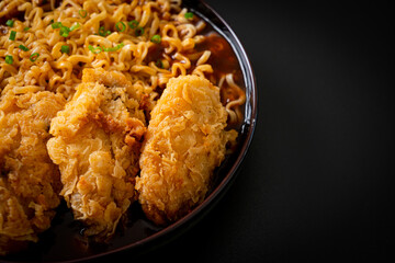 Korean instant noodles with fried chicken or Fried chicken ramyeon
