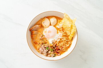 instant noodles with pork and meatballs in spicy soup