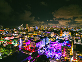 Fototapeta premium Ocean Drive in South Beach Miami Florida by drone at Night 4k
