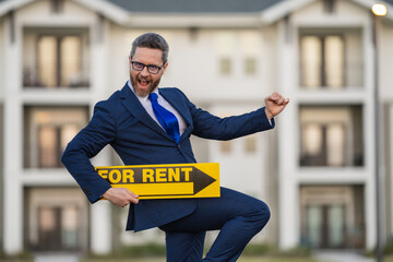 Rental house. Real estate agent hold house rent sign. Real estate sale or property rental concept....