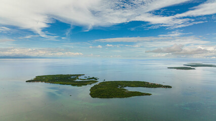 Tropical islands with jungle in the blue sea. Bantayan, Philippines.