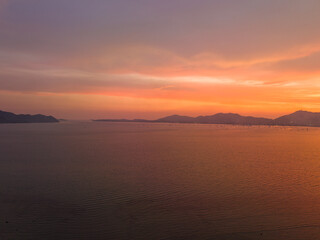Fototapeta premium .aerial view stunning sky in sunset above the sea..colorful cloud in bright sky of sunset above the ocean at Khao Khad Phuket. .Majestic sunset or sunrise landscape Amazing light of nature 