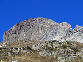 Fototapeta na wymiar Rocky mountain peak Piz Radönt or Piz Radoent (3064 m) in the Albula Alps and above the alpine valley Val Grialetsch, Zernez - Canton of Grisons, Switzerland (Kanton Graubünden, Schweiz)
