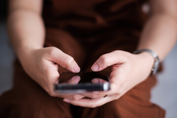 Close up of people hand using smart phone