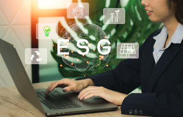 ESG, Environment Social Governance. Businesswoman working on laptop. Sustainable. Business organizational development. Technology of renewable resource to reduce pollution.