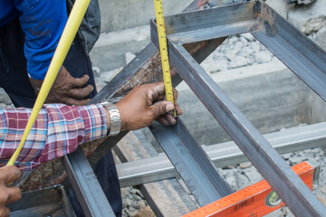 using tape measure for measuring size of stair