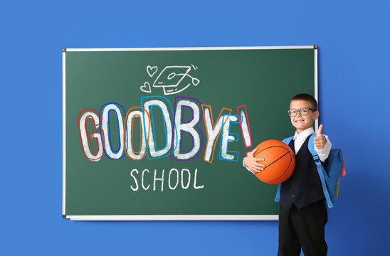 Little student with ball near blackboard with text GOODBYE, SCHOOL on blue background