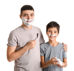 Father teaching his little son how to shave against white background