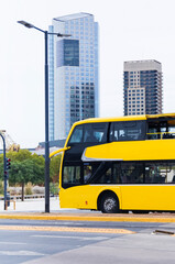 Fototapeta na wymiar Yellow bus travel in Buenos Aires, one day tour is a sightseeing tour of the city. vertical