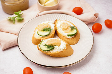 Delicious canapes with caviar of capelin on grey background