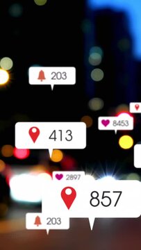 Animation of social media icons and numbers over out of focus city and traffic lights