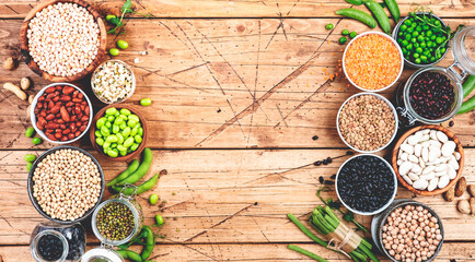 Legumes, beans and sprouts. Dried, raw and fresh, top view. Lentils, mung beans, chickpeas, soybeans, edamame, peas, Healthy diet food, vegan proetin, micronutrients and fiber sources, top view banner