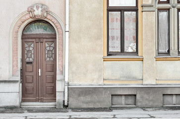 Fototapeta na wymiar View of old building with wooden door and windows