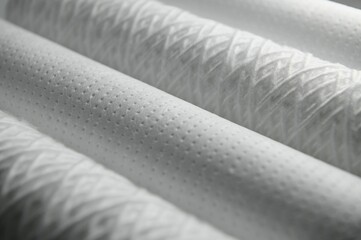 Cartridges for water treatment systems on white background.