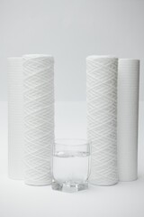 filter cartridges for water on a white background. Installation of reverse osmosis water purification system.