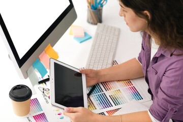 Obraz na płótnie Canvas Woman artist drawing something on a graphic tablet