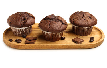Wooden board with tasty chocolate cupcakes isolated on white background