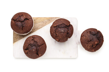 Board with tasty chocolate cupcakes isolated on white background