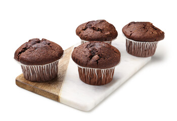 Board with tasty chocolate cupcakes isolated on white background