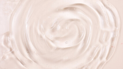 Cosmetic product texture, moisturizing lotion isolated on pink background, squeezed out and smeared...