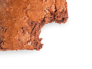 Piece of bitten chocolate brownie isolated on white background, closeup