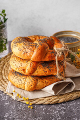 Stack of tasty pretzels on grunge table, closeup