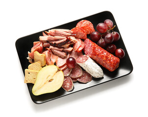 Plate with assortment of tasty deli meats isolated on white background