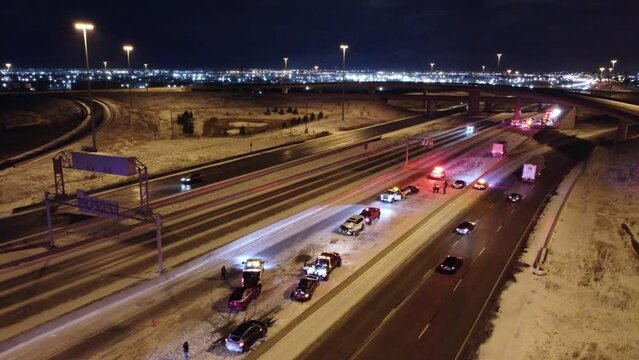 Aerial view of carnage after multiple vehicle pileup on highway during the night 