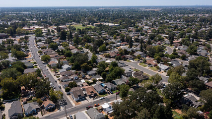 Afternoon aerial view of a suburban neighborhood of Elk Grove, California, USA. - obrazy, fototapety, plakaty