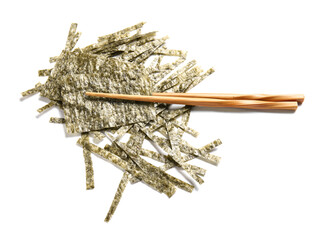 Chopsticks with cut nori sheets on white background